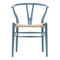 Light blue chair with a natural woven seat and minimalist Scandinavian design. Perfect for modern decor.