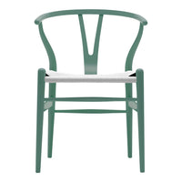 Green chair with a clean, minimalist design and a white woven seat, showcasing a modern aesthetic and elegant lines.