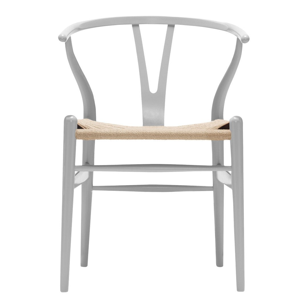 Gray wooden chair with a woven natural seat, featuring a minimalist design and clean lines. Ideal for modern decor.