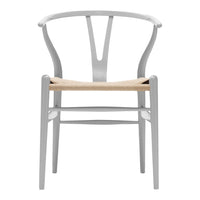 Gray wooden chair with a woven natural seat, featuring a minimalist design and clean lines. Ideal for modern decor.