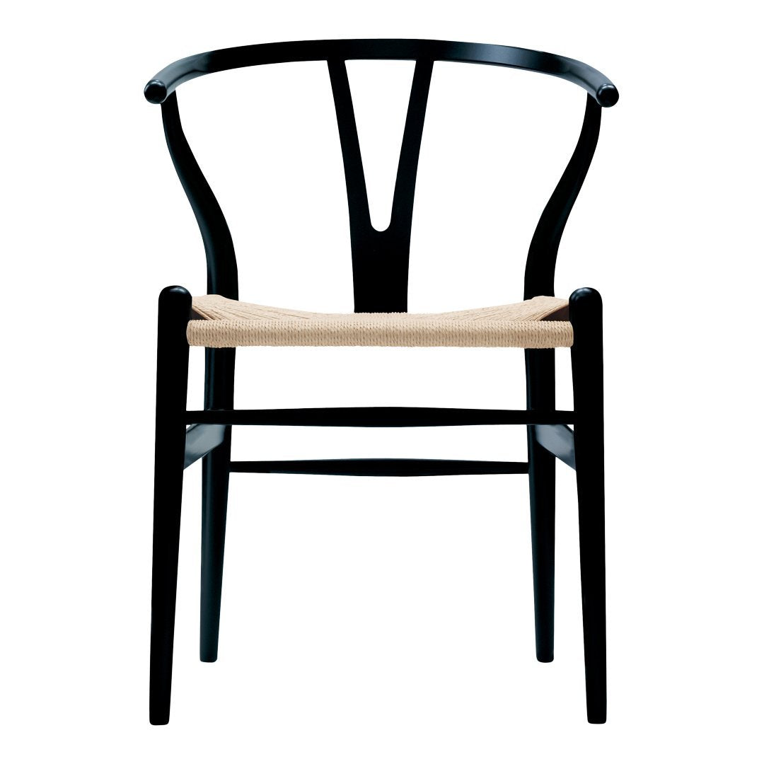 Black wooden chair with a minimalist design and natural woven seat. Elegant curves and modern styling.