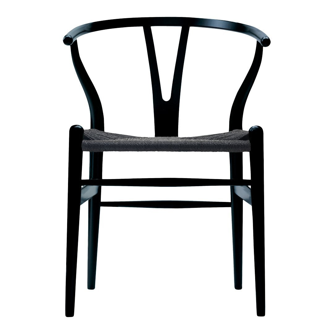 Elegant black wooden chair with a distinctive Y-back design and a textured gray seat cushion. Modern aesthetic.