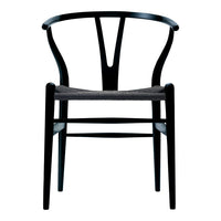 Elegant black wooden chair with a distinctive Y-back design and a textured gray seat cushion. Modern aesthetic.