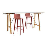 "Rectangular table with natural wood legs and two pink bar stools, featuring a sleek modern design."