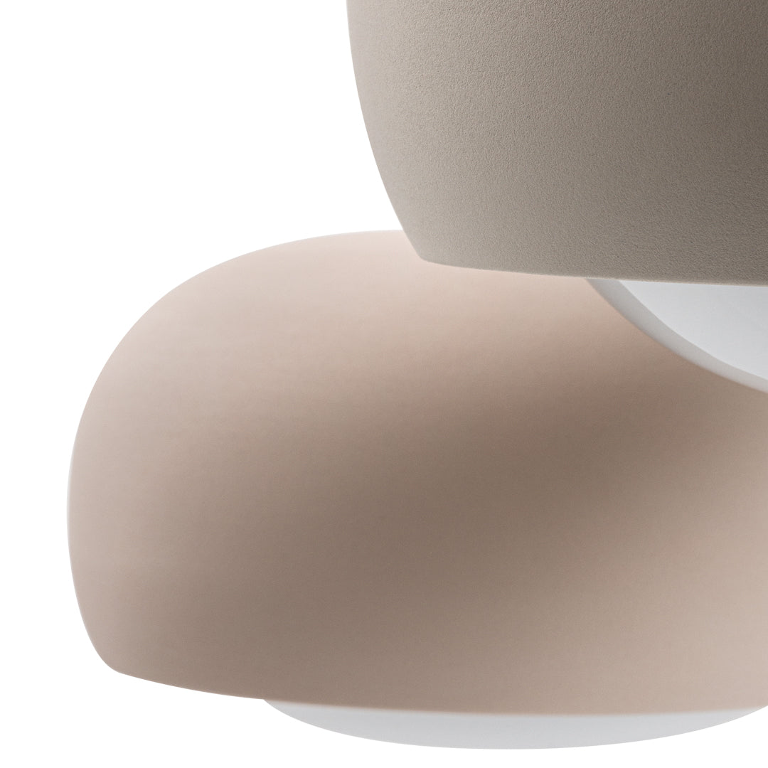 "Soft beige and taupe curves with a smooth matte finish, showcasing minimalist design and subtle color contrast."