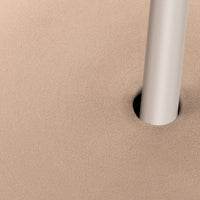 Beige textured surface with a sleek silver pole, featuring a minimalist design and smooth finish.