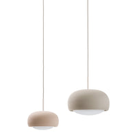 Two modern pendant lamps in soft pink and neutral beige, featuring smooth, rounded designs with white shades.