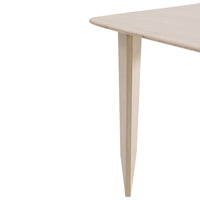 Light beige wooden table corner with sleek, angled legs, featuring a smooth, minimalist finish.