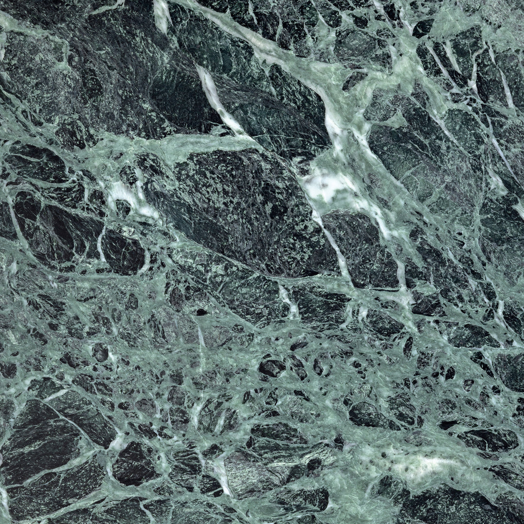 Dark green marble with white veining and intricate, swirling patterns. Elegant and sophisticated texture for décor.