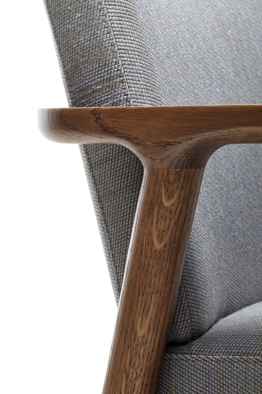 Gray textured fabric with a rich wood armrest, highlighting a modern and sophisticated design.