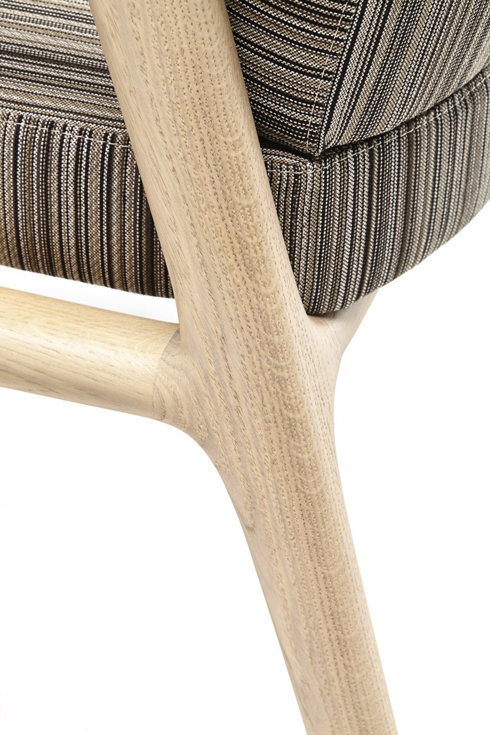 Soft beige wood frame supporting striped gray upholstery, showcasing a modern, textured pattern and neutral earthy tones.