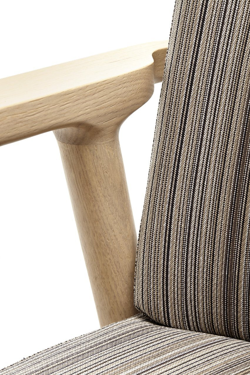 Striped upholstery in earthy tones of brown and beige with light wood accents. Modern design for stylish comfort.