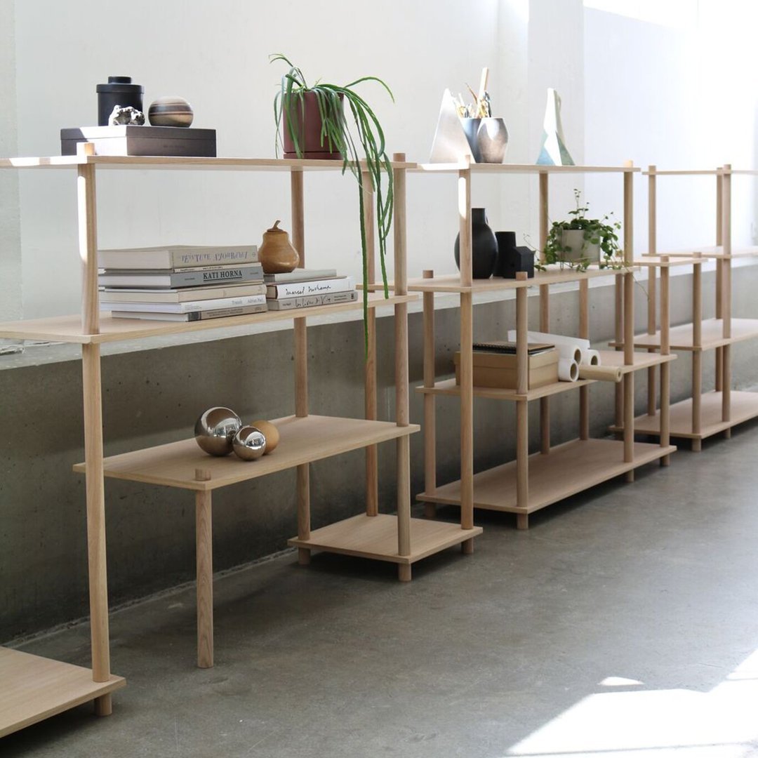 Light wood shelving unit featuring a minimalist design with clean lines, perfect for contemporary decor.
